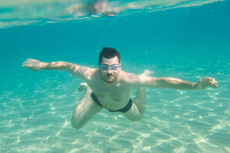 happy man swimming in Ionian sea,  Zakynthos, Greece, Underwater scene