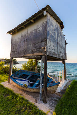 wooden structure on the pylons on the shores of Ionian Sea at sunset, Zakynthos, Greeceの写真素材