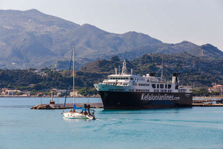 10 july 2016, ferry on the pier, zkynthos landscape on the background, Greeceのeditorial素材