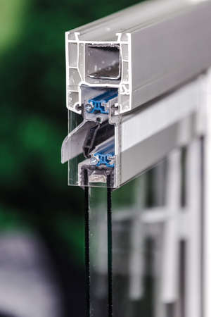 profile of a plastic window, a section of a multi-compartment double-glazed window close-up