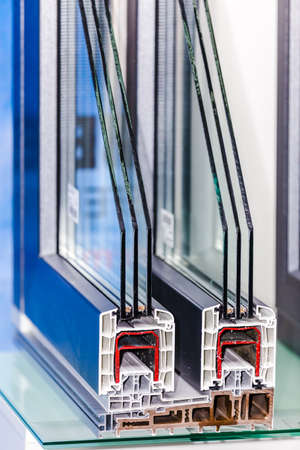 profile of a plastic window, a section of a multi-compartment double-glazed window close-upの写真素材