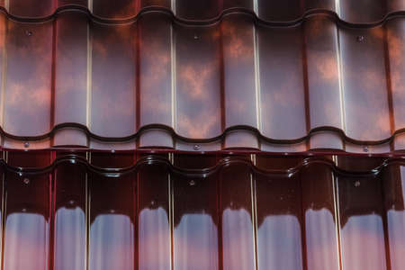 metal sheets of red color to cover the roofs, in the storefrontの写真素材