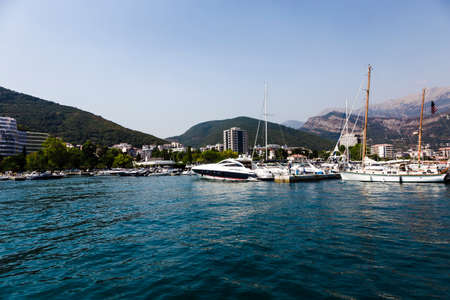 yachts in the background of mountains in budvaの写真素材