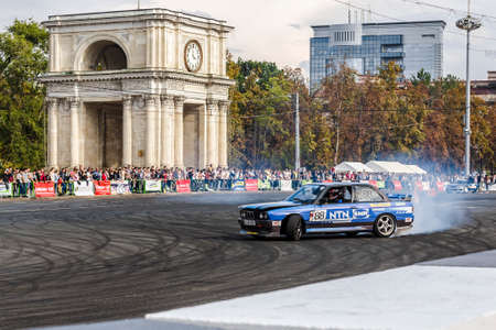 23 september 2017 drift in the center, in the city square BMW 3 Series against a background of numerous unidentified people makes a maneuver Chisinau,Moldovaのeditorial素材