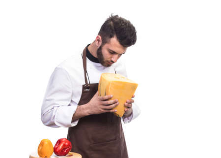 the chef looks thoughtfully at the cheeseの写真素材