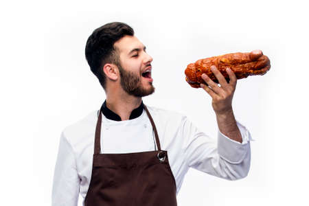 the cook pretends that he wants to eat the hamの写真素材