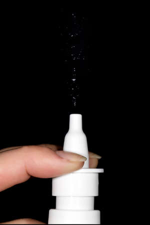 spray for the nose, close-up on a black backgroundの写真素材