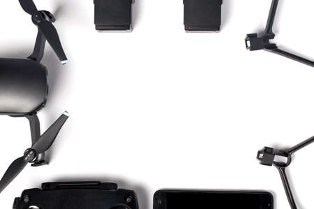 drone and its accessories are put in the shape of a frame on a white background with space for textの写真素材