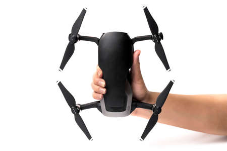 dji mavic air in hand, on a white background