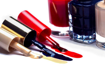 three  of an open varnish on a white background, colored lines near brushes