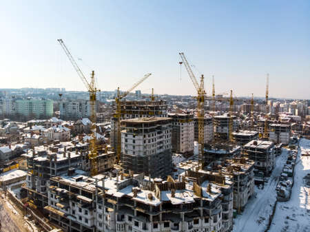 construction of a residential complex, air filming, background image on a winter dayの写真素材