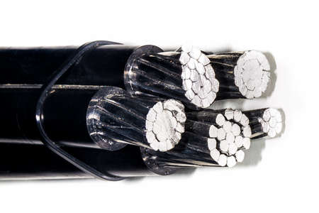 five high-voltage, black, bare wires, on white background, close-up, with place for textの写真素材