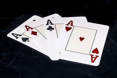 four aces shape on school blackboard concept, photo with space for textの写真素材