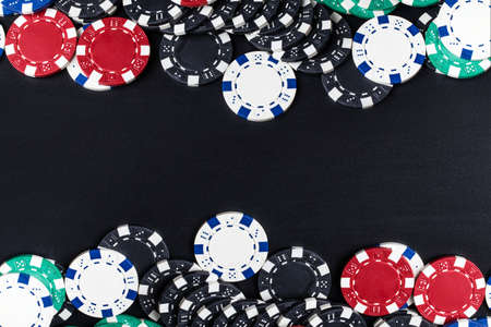 background of set of colored chips for playing poker with space for textの写真素材