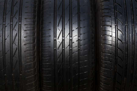 black tires for the car in the form of a background, close-up photo