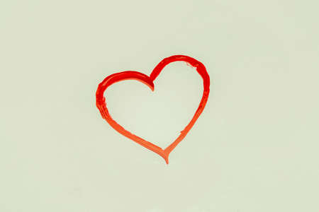 heart painted with red lacquer, toned background imageの写真素材