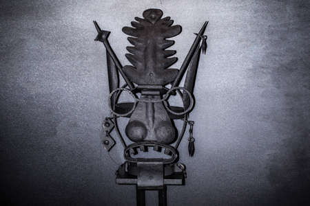 Instruments of torture times of inquisition, mask on a gray background with space for text