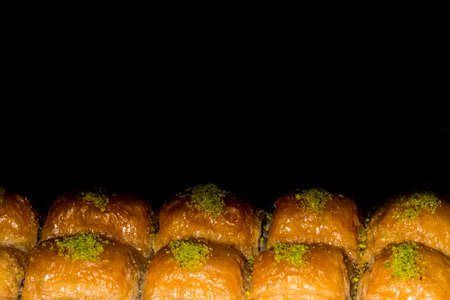 Buns with garlic on a black background with space for tex