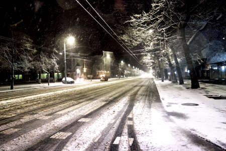 snow machine on a snowy road at nightのeditorial素材