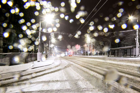 night snow-covered road with highlightsのeditorial素材