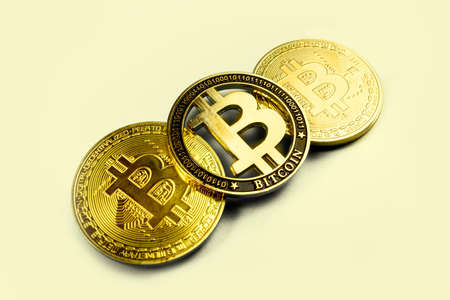 golden bitcoins on a light background, image with place for textの写真素材