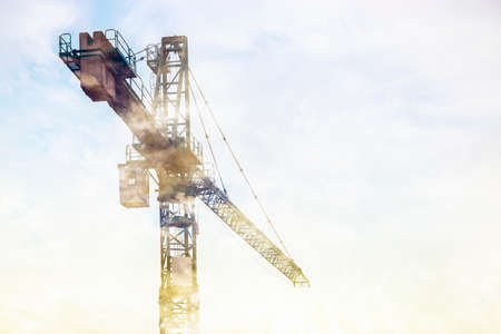 construction crane in the fog, background image with copy spaceの写真素材