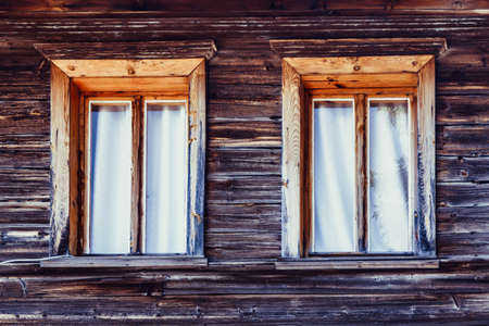 hut and two windows with curtain, background imageの写真素材
