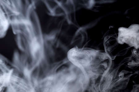 photo of developing smoke from a cigarette on a black background