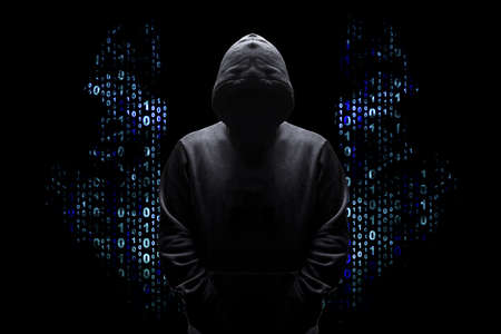 silhouette of a man in a hood with wings from a binary code, concept angelic good hacker