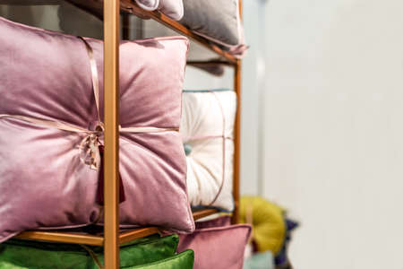 colored decorative pillows on the shelf, background image with  copy spaceの写真素材