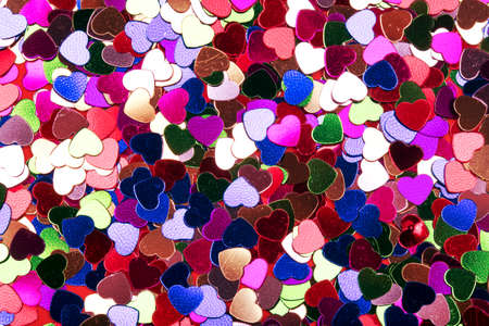 many small decorative hearts of different colors, background imageの写真素材