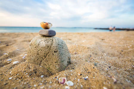 image of shell on cairn  on the sandy shoreの写真素材