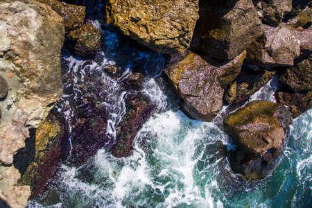 image of stones in the sea with waves, aerial viewの写真素材