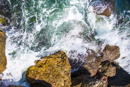 image of stones in the sea with waves, aerial viewの写真素材