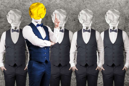 business blank, studio portrait of a man in a suit with a light bulb instead of a head in search of an ideaの写真素材