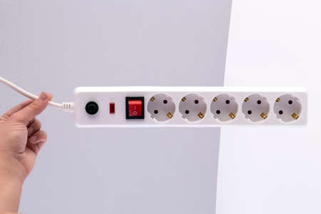 power extension cord with on-off switch in handの写真素材