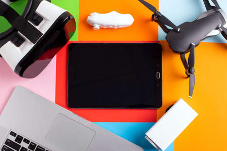 set of modern gadgets on a colorful background, mock up of new technologiesの写真素材