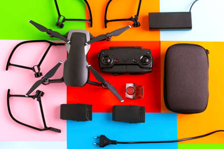 control panel, drone and its accessories on a colorful backgroundの写真素材