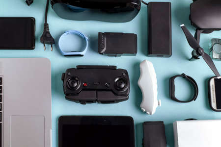 background of modern gadgets on a blue surfaceの写真素材
