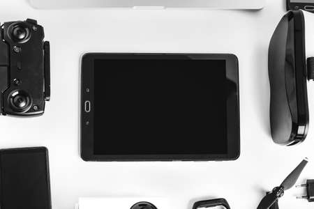 modern gadgets in the form of a frame on a white background in the center of the tabletの写真素材