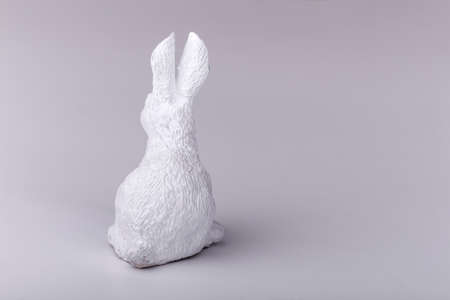 white Easter bunny from the back, the concept of the end of Easter holidaysの写真素材