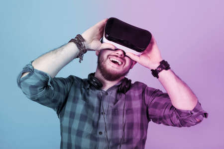 satisfied man in glasses of virtual reality(VR device), colorful toned image