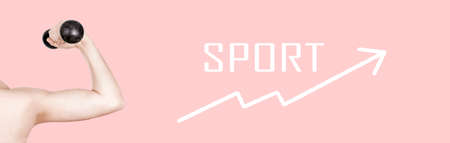 skinny arm with dumbbell on pink background, concept before sport, panoramic imageの写真素材