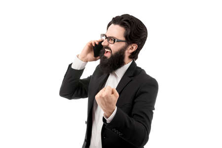 aggressive bearded businessman shouting on the smartphone, isolated on white background