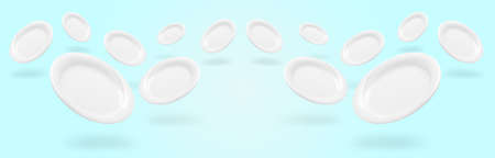 levitating white empty plates over blue background, panoramic imageの写真素材