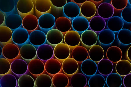 A pattern of vibrantly colored drinking straws, concept accessories to celebrate your partyの写真素材
