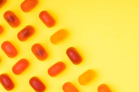 chewy candy mock-up over yellow backgroundの写真素材