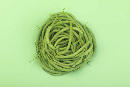 bunch of green beens on green backgroundの写真素材
