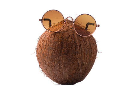 Coconut with sunglasses, concept art of summer and vacation, coconut isolated on white backgroundの写真素材