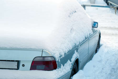 Parked car after winter blizzardの写真素材
